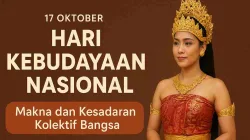 Perempuan Indonesia memakai busana adat Bali berwarna merah dan emas dengan latar cokelat, menandai peringatan Hari Kebudayaan Nasional 17 Oktober.